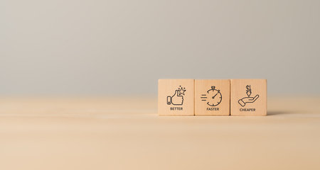 Market positioning; Marketing strategy concept; Better; Faster; Cheaper. Wooden blocks labeled Cheape; Faster and Better. Business value; market positioning; competitive positioning.の写真素材