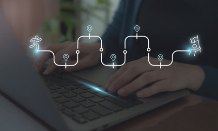 Career Path, Career Journey Concept. Typing on laptop with an overlay of a roadmap, representing...