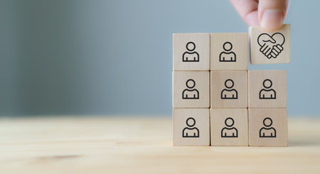 Empathy in leadership concept. Wooden block symbolizing empathy and partnership among blocks...