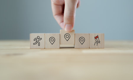 Career Path and Development Strategy Concept. Arranging wooden blocks with icons success roadmap and...