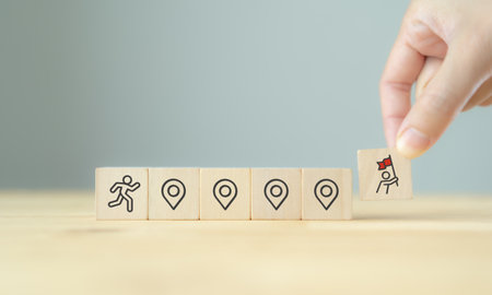 Career Path and Development Strategy Concept. Arranging wooden blocks with icons success roadmap and...