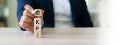 KPI target and business performance.  Measuring achievement effectively. Wooden blocks showing KPI letters and  target icon. Goal setting, performance evaluation and strategic business success.の写真素材