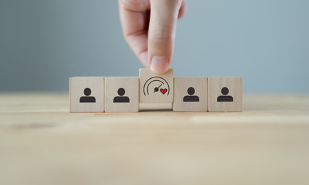 Soft Skills and Leadership concept. Building a team with emotional intelligence. Wooden blocks with emotional intelligence performance icon. Soft skills, leadership and empathy in workplace.の写真素材