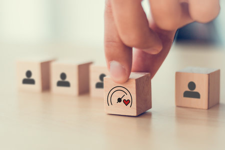 Soft Skills and Leadership concept. Building a team with emotional intelligence. Wooden blocks with emotional intelligence performance icon. Soft skills, leadership and empathy in workplace.の写真素材