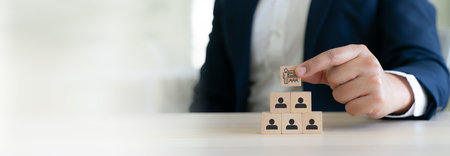 Training and Workforce Development. wooden blocks with training  and human icons, symbolizing structured learning, skill development and leadership driven training programs. Learning management systemの写真素材