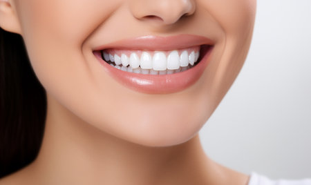 Close-up of smiling young woman with healthy teeth. Dentistry concept.の素材