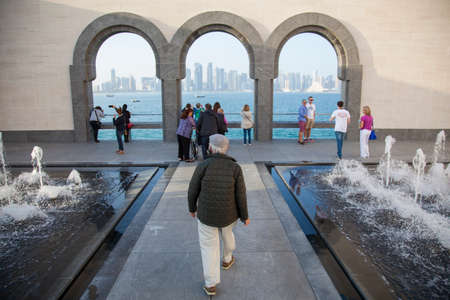 Doha, Qatar - 12/23/2016: people at courtyard of Museum of Islamic Art with fountains and arched...