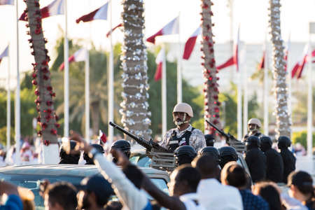 Doha, Qatar - December 18, 2017: Perform of military and civil machines on National Day parade on the Corniche street, Doha, Qatarのeditorial素材