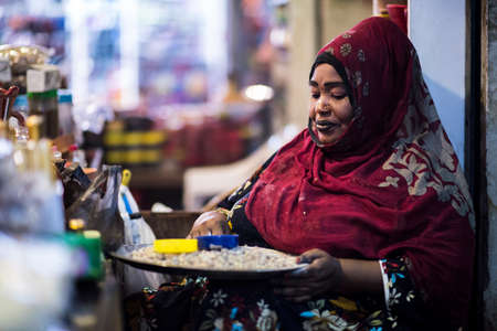 Muscat,Oman - March 05,2019 : Night views of the streets, shops and local people in various activities in the market of old town Mutrah.のeditorial素材