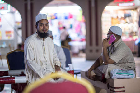 Muscat,Oman - March 05,2019 : Night views of the streets, shops and local people in various...