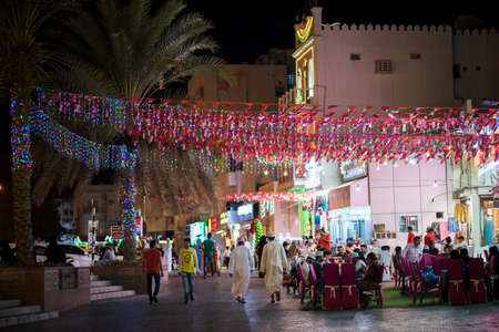 Muscat,Oman - March 05,2019 : Night views of the streets, shops and local people in various...