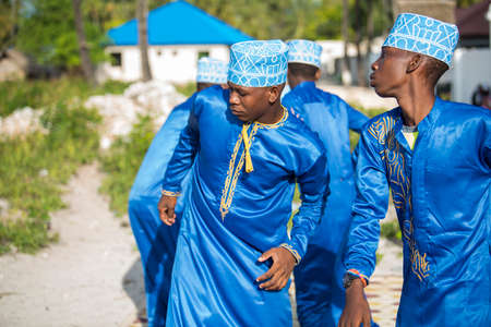 Zanzibar City,Tanzania-January 05,2019: Local people dressed in traditional attire perform a musical...