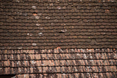 Ruined tiles on the old house.の写真素材