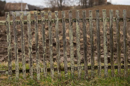 Sunja, Croatia, April 11,2022 : Old dilapidated wooden fence in a rural area.の写真素材