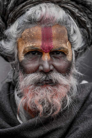 Kathmandu, Nepal- March 20,2022 : Sadhu-Indian Holymen sitting in the temple. In Hinduism, Sadhu is a common term for a mystic, an ascetic, practitioner of yoga.のeditorial素材