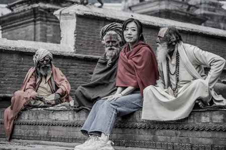 Kathmandu, Nepal- March 20,2022 : Sadhu-Indian Holymen sitting in the temple. In Hinduism, Sadhu is a common term for a mystic, an ascetic, practitioner of yoga.のeditorial素材