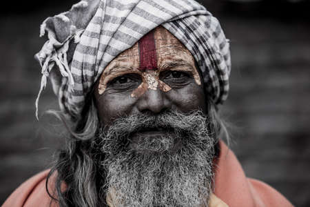 Kathmandu, Nepal- March 20,2022 : Sadhu-Indian Holymen sitting in the temple. In Hinduism, Sadhu is...