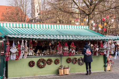 Munich, Germany - December 20,2021 : Market stall offering Christmas decor on Viktualienmarkt in Munich.のeditorial素材