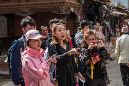 Kathmandu, Nepal- March 20,2022 : Tourists tour the Patan Durbar Square. Patan is one of the oldest know Buddhist City.のeditorial素材