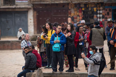Kathmandu, Nepal- March 20,2022 : Tourists tour the Patan Durbar Square. Patan is one of the oldest know Buddhist City.のeditorial素材