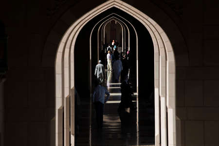 Muscat, Oman - March 05,2019 : Tourists tour in the Sultan Qaboos Grand Mosque.
