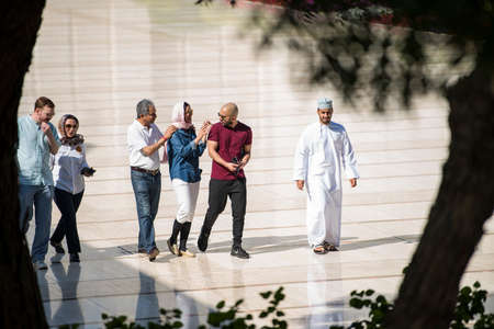 Muscat, Oman - March 05,2019 : Tourists tour in the Sultan Qaboos Grand Mosque.のeditorial素材