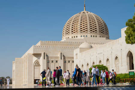 Muscat, Oman - March 05,2019 : Tourists tour in the Sultan Qaboos Grand Mosque.のeditorial素材