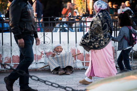 Marrakesh, Morocco - February 28, 2018: Beggars and the homeless on the streets of ancient Medina district of Marrakech.のeditorial素材