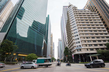 Singapore City,Singapore - September 08, 2019: Low wide-angle view looking up to modern skyscrapers in business district of Singapore City.のeditorial素材