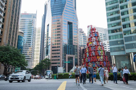 Singapore City, Singapore - September 08, 2019: At the end of the working day
office workers walking...