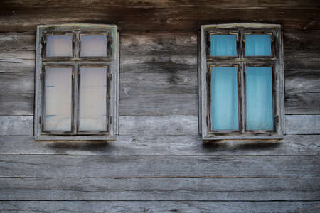Sunja, Croatia, April 20,2021 : Rustic style aged window at rural home wall.の写真素材