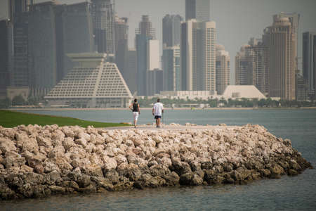 Doha,Qatar - March 05, 2020 : People enjoying a sunny day in the park of the Museum of Islamic Art...