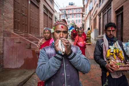 Kathmandu, Nepal- April 20,2019 : Hindus perform a religious ritual by walking on the streets Patan...