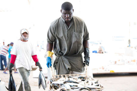 Muscat,Oman - March 05,2019 : Workers of fish market in the old town Matrah.