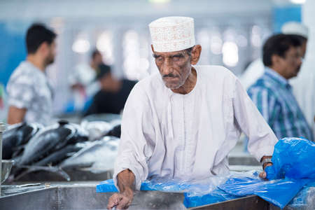 Muscat,Oman - March 05,2019 : Workers of fish market in the old town Matrah.