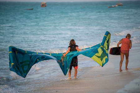 Zanzibar, Tanzania - January 02,2019: Tourists enjoy in kiteboarding on the sandy beaches of Zanzibar.のeditorial素材