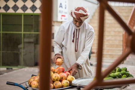 Muscat,Oman - March 05,2019 : Merchants in market shops of the old town Mutrah.のeditorial素材
