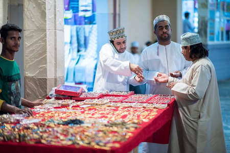 Muscat,Oman - March 05,2019 : Merchants in market shops of the old town Mutrah.