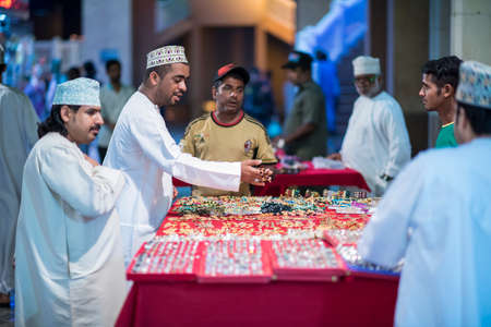 Muscat,Oman - March 05,2019 : Merchants in market shops of the old town Mutrah.