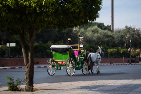 Marrakesh, Morocco - February 28, 2018: Carriages on the streets of Marrakesh that serve for tourist...
