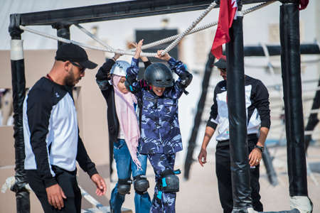Doha, Qatar, December 18,2019. Qatari children are playing at an artificial condominium military...