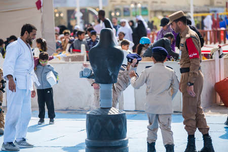Doha, Qatar, December 18,2019. Qatari children are playing at an artificial condominium military training ground to celebrate Qatar national day.のeditorial素材