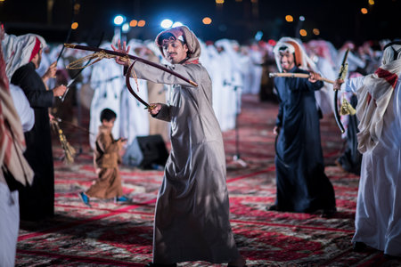 Doha,Qatar - December 18,2017. Traditional bedouin sword dancing for celebration Qatar national day.のeditorial素材