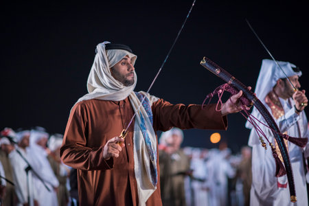 Doha,Qatar - December 18,2017. Traditional bedouin sword dancing for celebration Qatar national day.のeditorial素材
