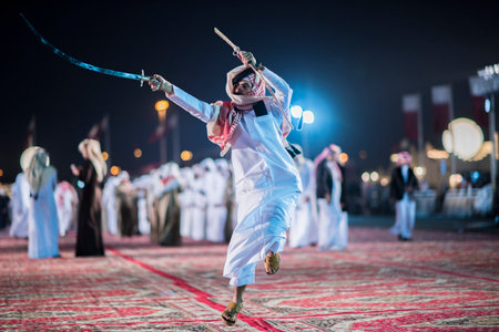 Doha,Qatar - December 18,2017. Traditional bedouin sword dancing for celebration Qatar national day.