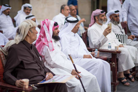 Doha,Qatar, April 15,,2022, Local people at auction of antiques on the passage of the old market market souk Waqif.のeditorial素材