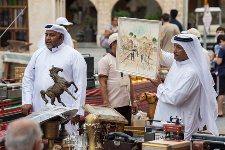 Doha,Qatar, April 15,,2022, Local people at auction of antiques on the passage of the old market market souk Waqif.のeditorial素材