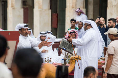 Doha,Qatar, April 15,,2022, Local people at auction of antiques on the passage of the old market market souk Waqif.のeditorial素材