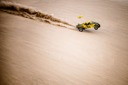 Doha, Qatar- February 23, 2018: Off road buggy car in the sand dunes of the Qatari desert.のeditorial素材