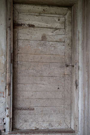 Croatia, April 20,2022: Old wooden rustic doors on rural home wall.のeditorial素材